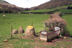 Image showing inappropriate location of fence and feeding trough in close proximity to archaeological features © CADW